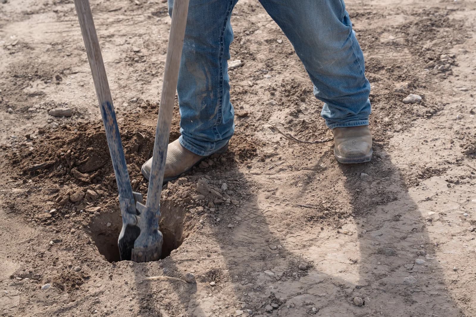Turning the first earth on the site with hand tools